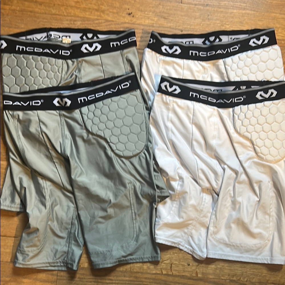 2 Gray and 2 White padded compression shorts